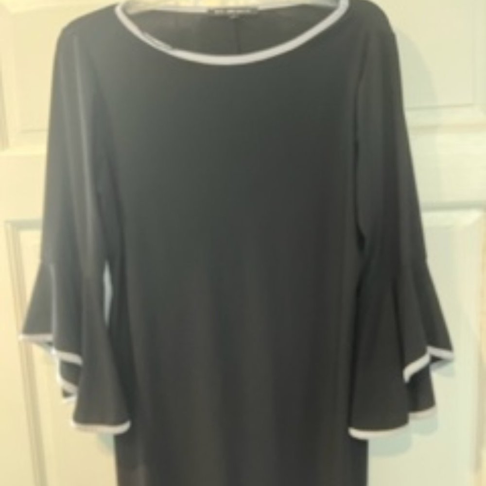 Black dress with white piping with fancy flouncy sleeves